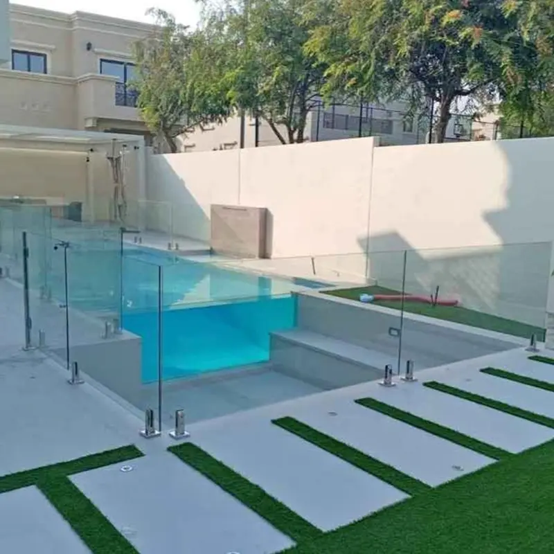 Crystal clear frameless glass pool fence installation for a luxury villa in Dubai