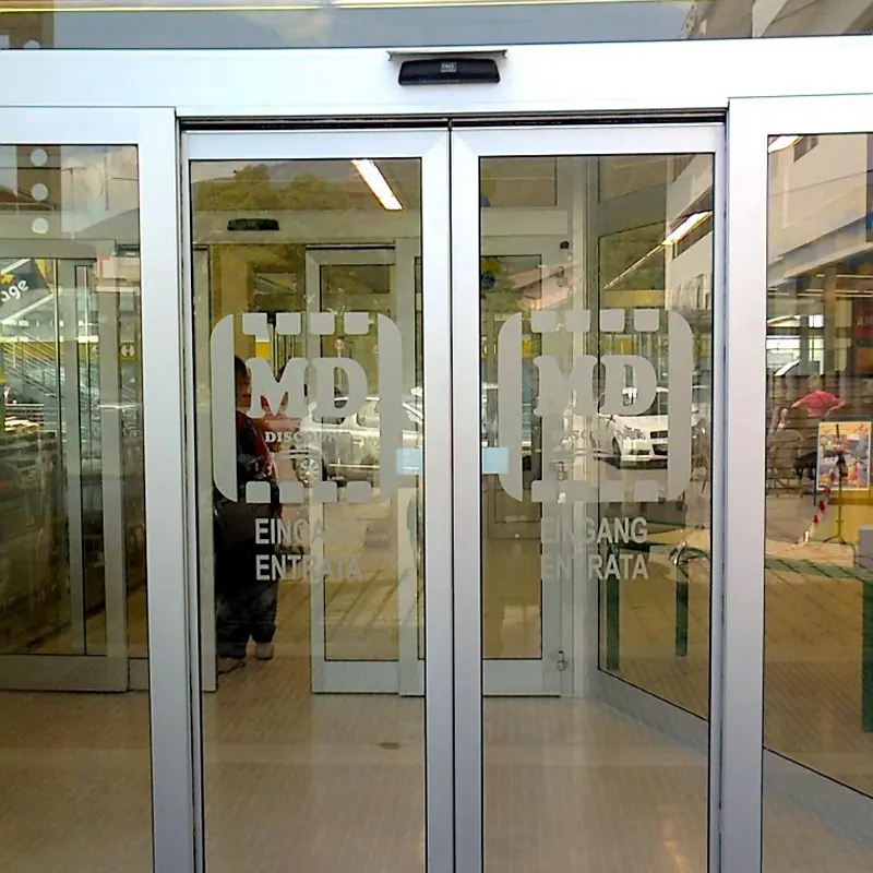 Smart technology motorized sliding and folding doors for modern automated home entry.