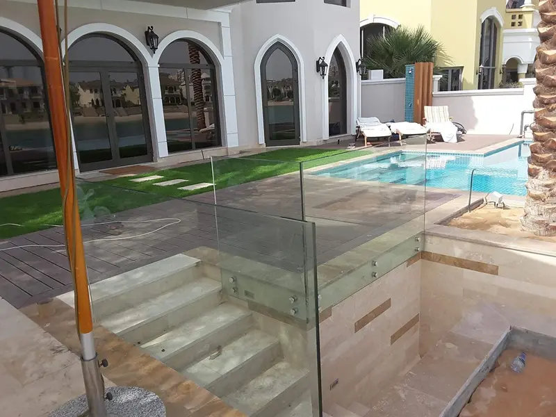 Durable glass railing for balcony and terrace with top-mounted aluminium U-channel.