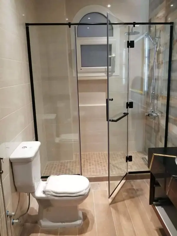 Black aluminium frame shower glass enclosure with sleek hardware.