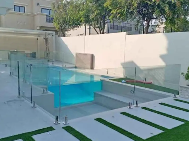 Made-to-measure frameless glass fence panels for luxury residential villa architecture.