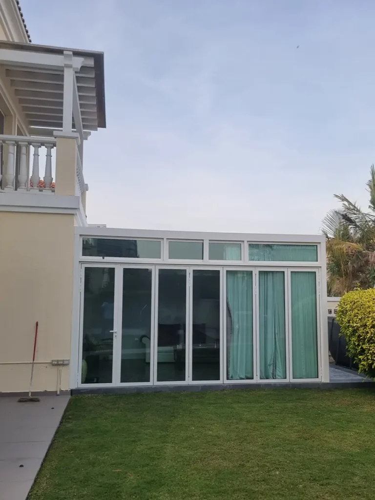Full glass room extension with aluminium frames for residential villas.