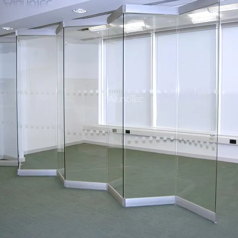 Minimalist frameless folding glass doors with no visible vertical profiles for a clear view.