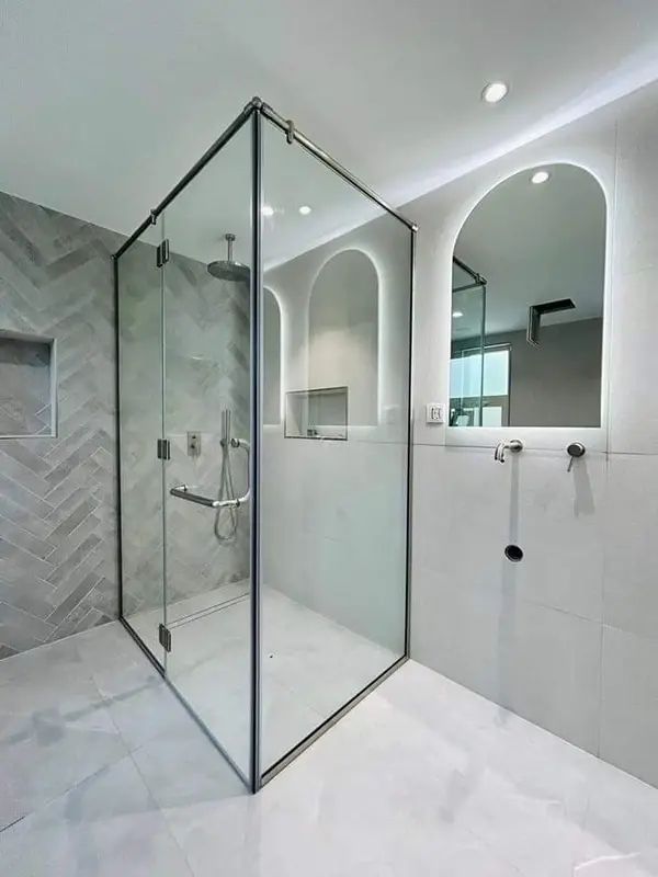Frameless tempered glass shower partition for modern Dubai homes.