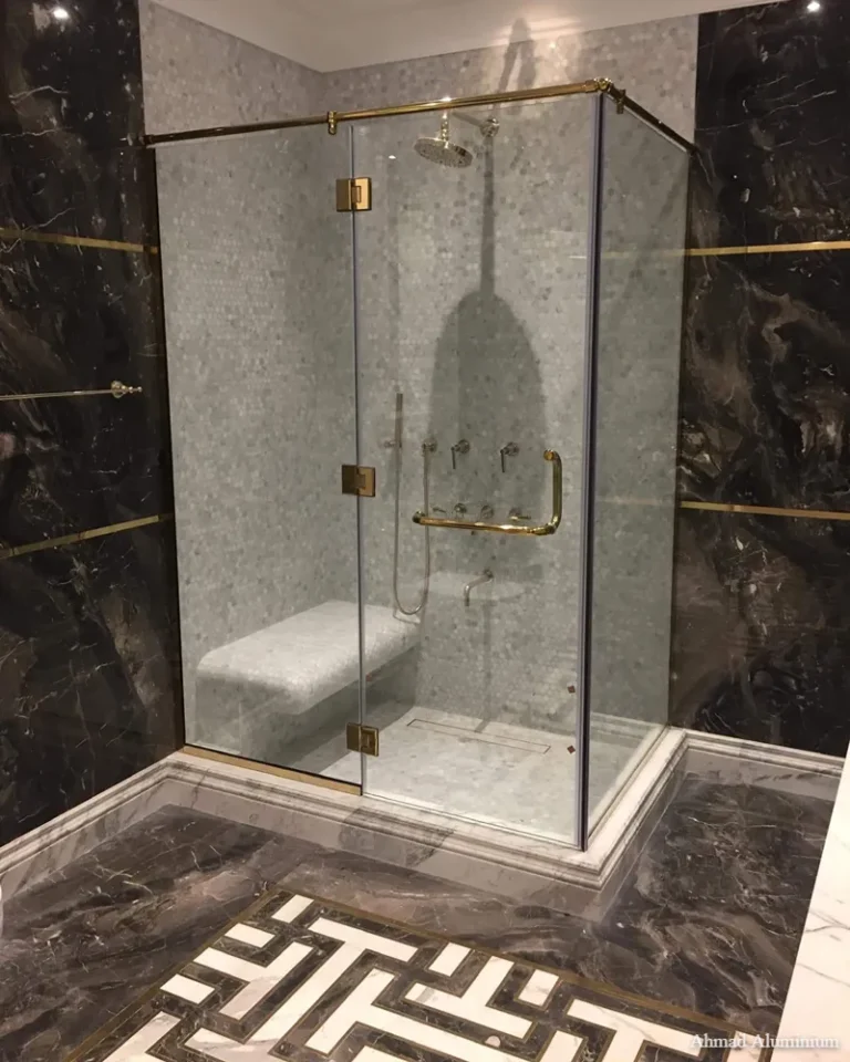 Space-saving corner entry glass shower cabin with polished chrome profiles.