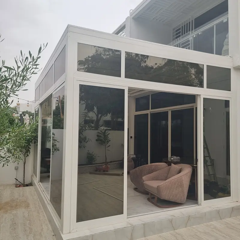 Stunning garden glass room enclosure creates a year-round oasis for relaxation and entertaining.