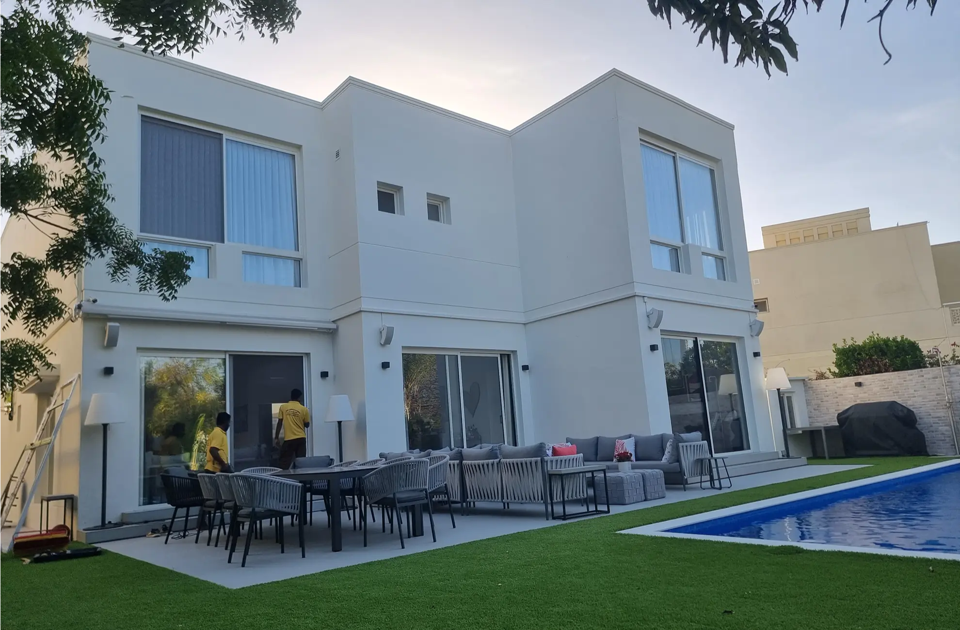 Safety tempered glass pool fencing with stainless steel spigots for a residential villa pool area.