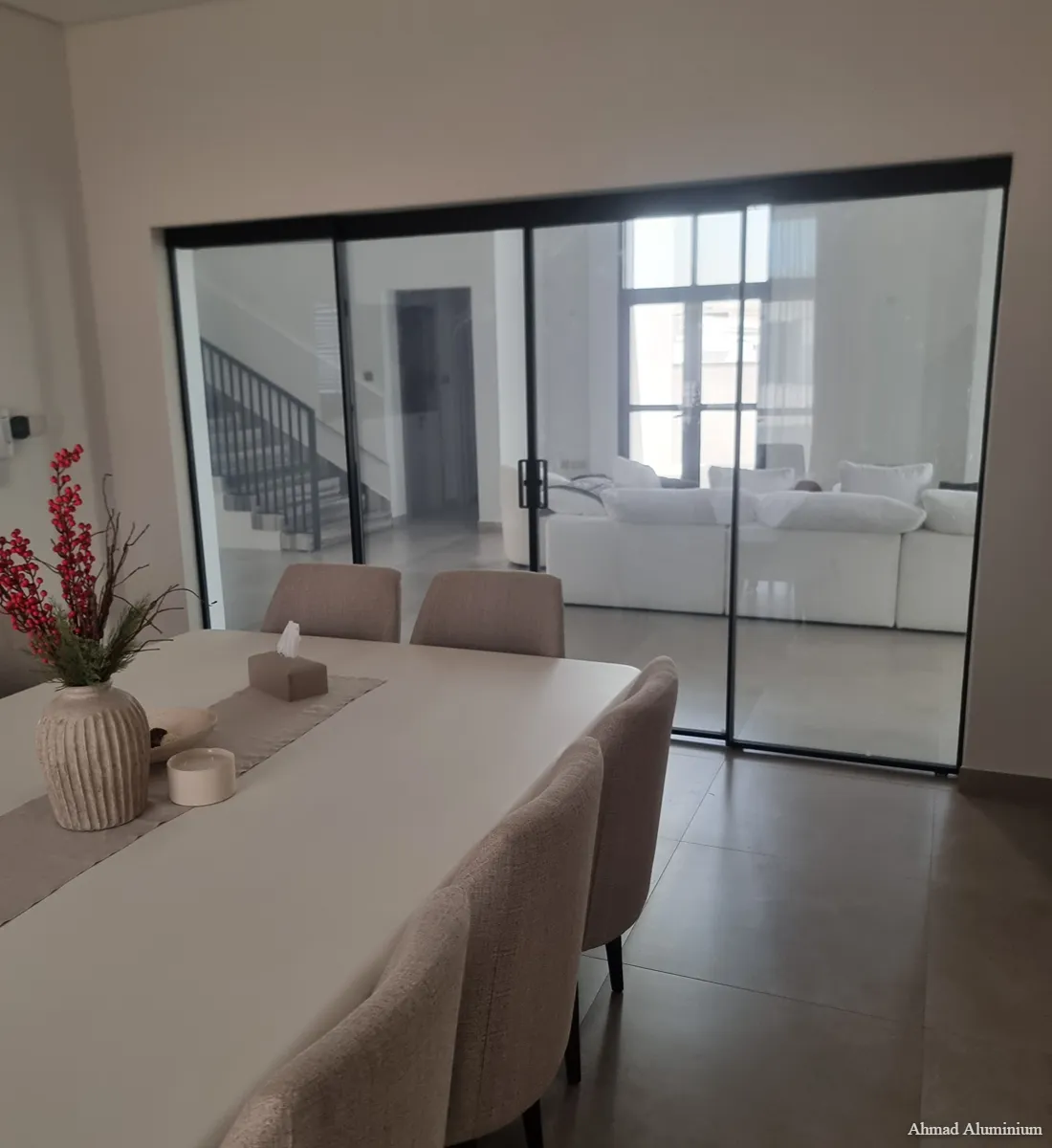 Slim profile aluminium and glass room partition for luxury residential interior.