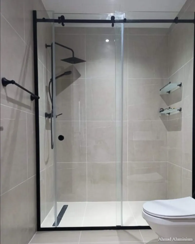 Smooth-sliding glass shower door with stainless steel tracks and rollers.