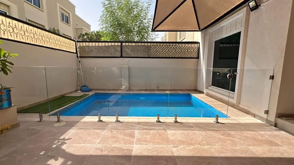 Safety-first self-closing glass pool gate with child-proof magnetic lock system.