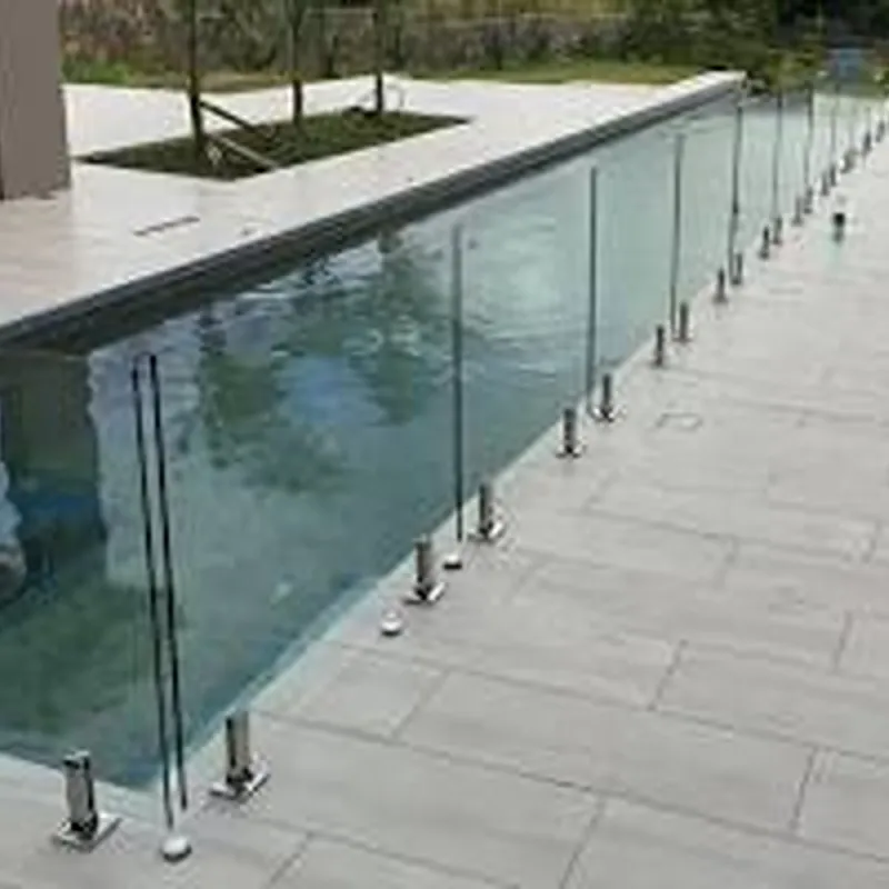 Durable semi-frameless glass pool fence with powder-coated black aluminium posts for extra safety.
