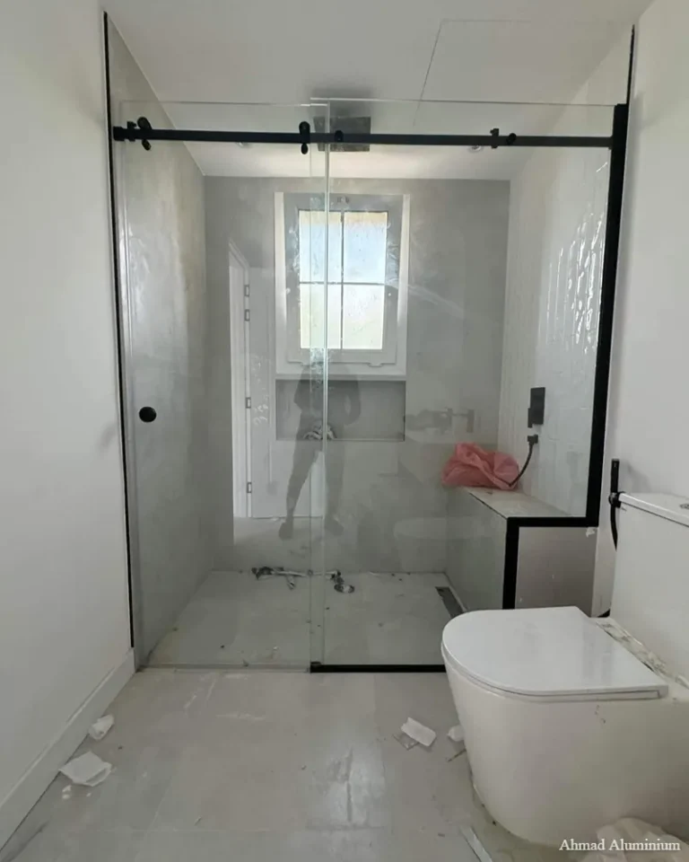 Sandblasted frosted privacy glass panel for bathroom shower partitions.