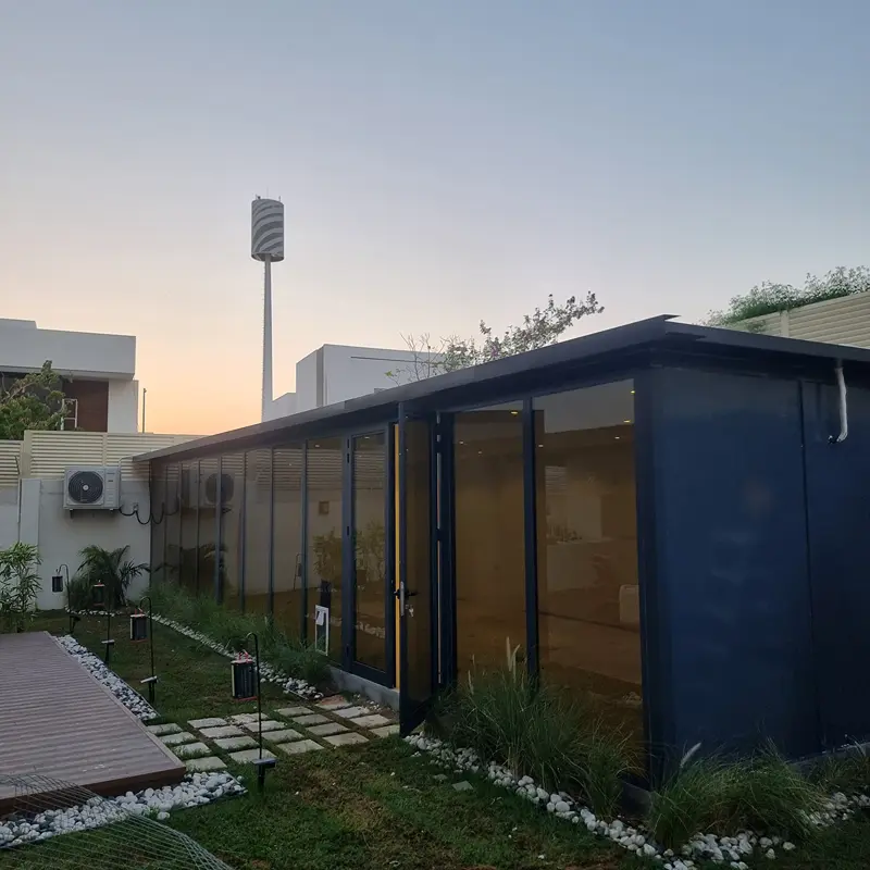 Custom patio glass room with sliding panels for year-round enjoyment of outdoor spaces.