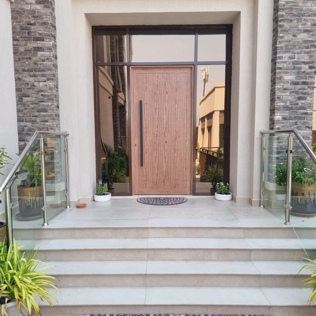 Modern black aluminium villa front door custom installation by Ahmad Aluminium in JVT Dubai