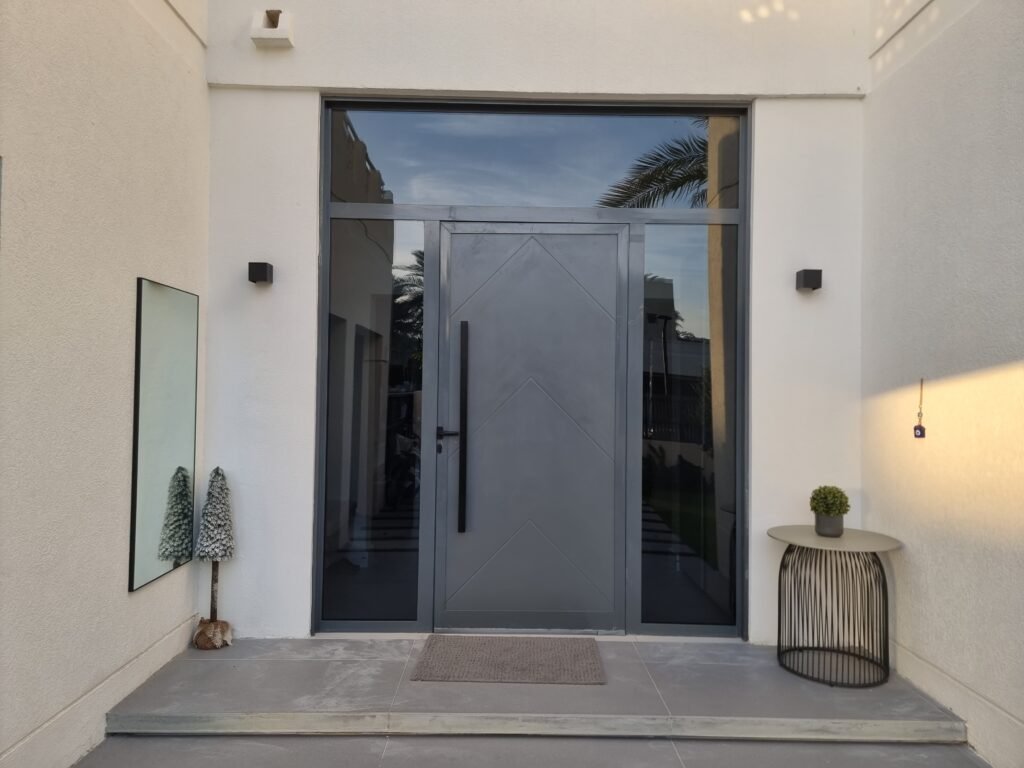 High-performance thermally broken black aluminium front door custom made by Ahmad Aluminium